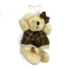 Fakopáncs Plüss maci lány (bézs színű maci, zöld ruhában, masnival) fajáték